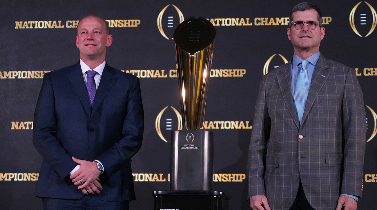 Washington’s Kalen DeBoer, Michigan’s Jim Harbaugh pose in front of 2024 College Football Playoff trophy.